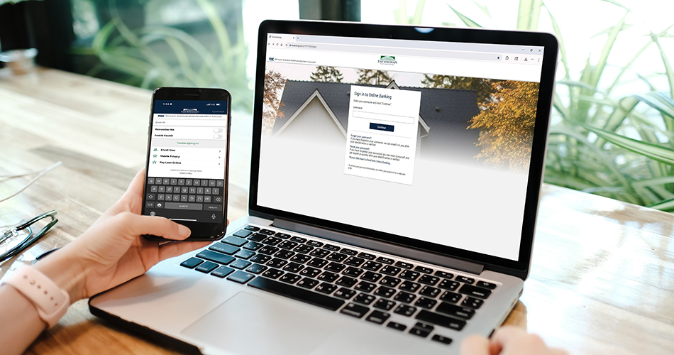 phone and laptop on online banking