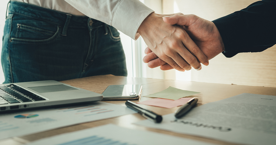 handshake over table